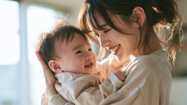 我が子を愛おしそうに抱きしめる日本人の若い母親