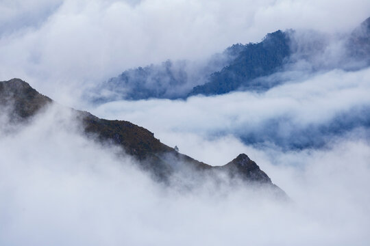 View from Vereda do Pico Ruivo over the mountains at Sunset, mist and clouds rolling in