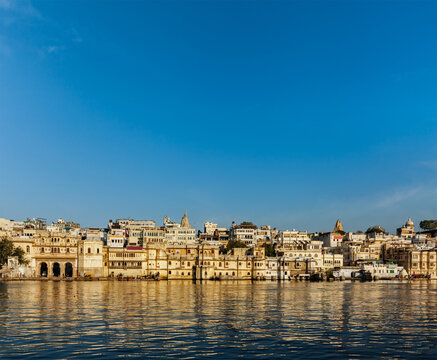 Scene featuring udaipur houses and ghats on lake Pichola. Udaipur, Rajasthan, India
