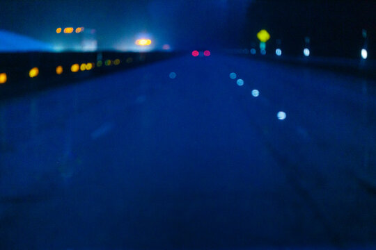 Limited visibility on the wet surface of Interstate 90 through the Cascade Mountains
