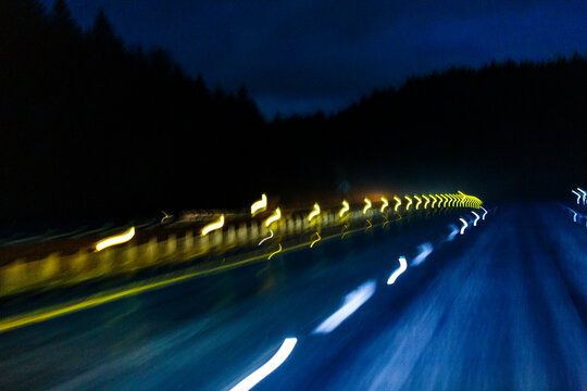 Limited visibility on the wet surface of Interstate 90 through the Cascade Mountains