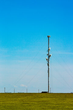 Cell tower in a rural landscape, phone signal coverage in the countryside.