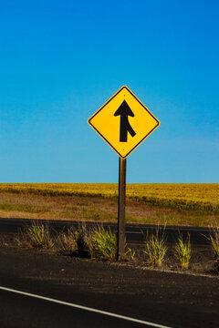 Yellow merge sign onto highway on Interstate 90.