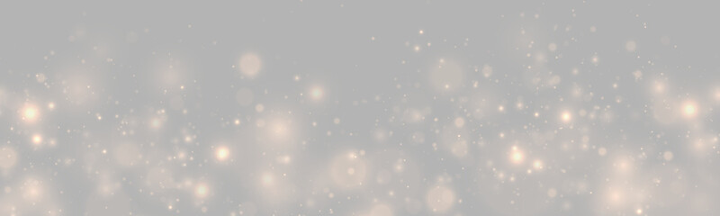 Golden glitter dust shines across transparent background with warm bokeh lights and magical festive sparkle. Luxury design element. PNG resource. © Freesstock