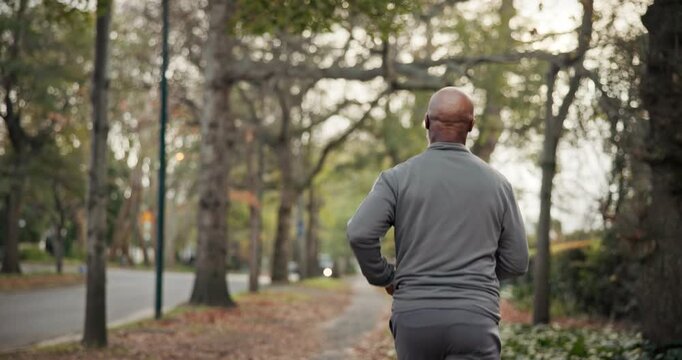 Cardio, fitness and man on road, running and endurance for physical activity or active for wellness. Outdoor, runner and mature person with energy for jog, back and workout routine for health in city