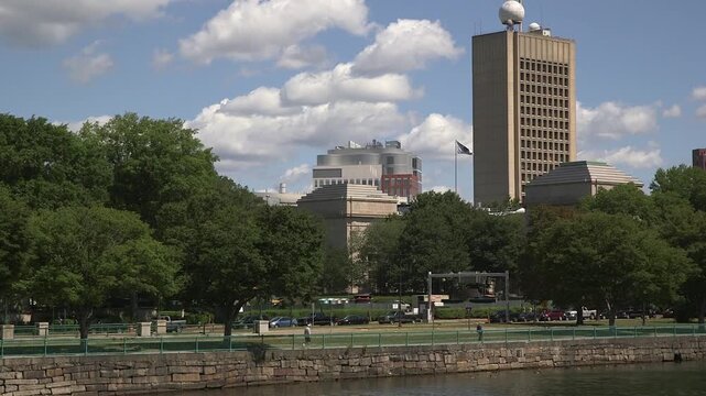 MIT campus skyline featuring a Building tower, viewed across the Charles River park in Cambridge, Massachusetts