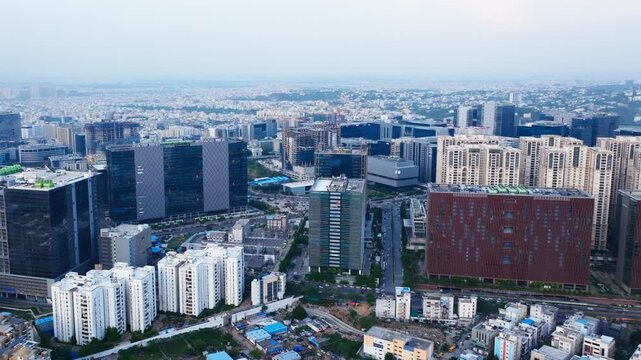 Aerial view of knowledge city with high-rise buildings, glass facade buildings and The Skyview at rai durg, gachibowli, hyderabad, telangana, india. day time, push in shot, drone shot, 4k.