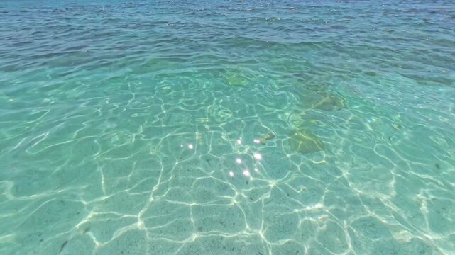Crystal clear sea water at Mari Ermi quartz beach, Sinis Peninsula, Sardinia, Italy