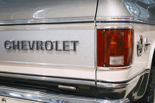 Rear tailgate of Chevrolet K5 Blazer featuring embossed branding, brushed aluminum trim, rectangular taillight and restored classic bodywork.
