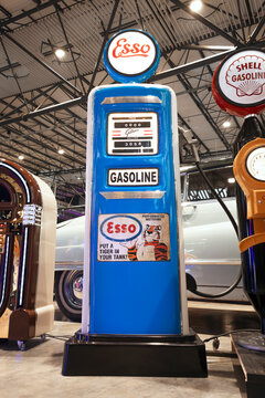 Restored vintage Gilbarco fuel pump featuring Esso branding, Put a Tiger in Your Tank slogan, and illuminated globe.