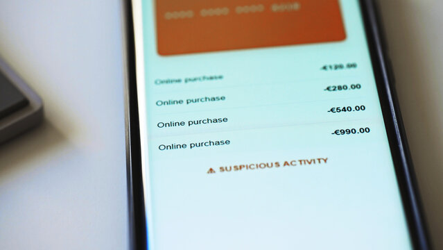 Suspicious activity detected message on smartphone screen.