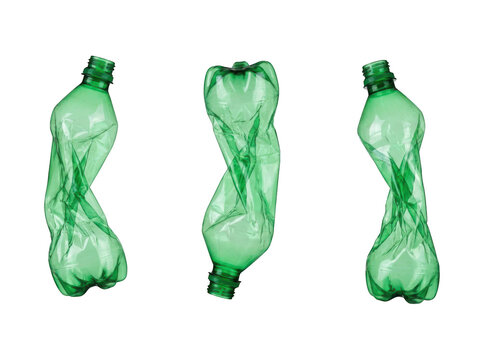 Three empty crushed green plastic bottles isolated on transparent background