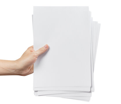 Stack of blank white paper sheets held in hand, isolated on transparent cutout background