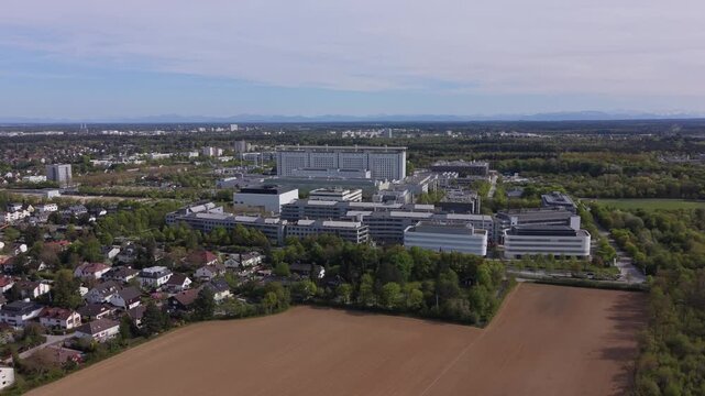 Aerial cityscape showing LMU Klinikum Munich, Germany. University hospital campus with modern architecture, healthcare services, education, research and German healthcare system infrastructure.