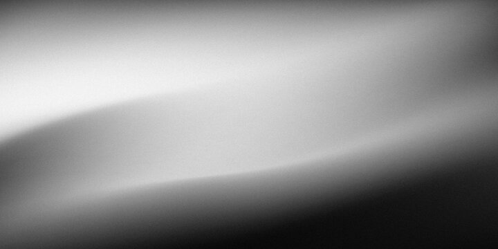 Smooth grayscale gradient background with subtle light reflection and soft focus for abstract design