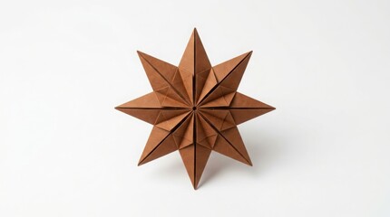 A brown paper origami star with eight sharp points, folded from textured craft paper, isolated on a clean white background surface