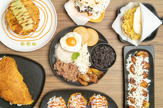 Venezuelan food spread with pabellon criollo and various dishes