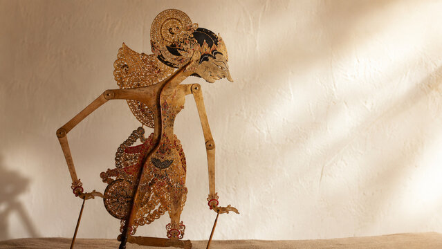 Traditional Indonesian Wayang Kulit Leather Shadow Puppet with Intricate Golden Detail