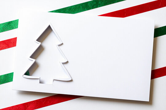 Minimalist Festive White Cardboard Christmas Tree Cutout with Red Star Design