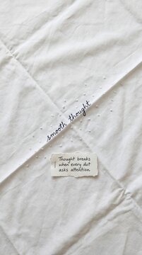 Minimalist Flat Lay of Handwritten Notes on Textured White Sheet for Low Attention Span