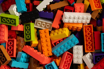 Fototapeta premium Colorful mix of plastic Lego building blocks and bricks background