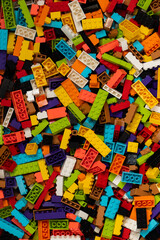 Fototapeta premium Colorful mix of plastic Lego building blocks and bricks background