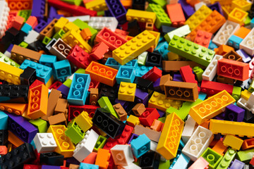 Fototapeta premium Colorful mix of plastic Lego building blocks and bricks background