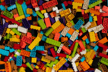 Fototapeta premium Colorful mix of plastic Lego building blocks and bricks background