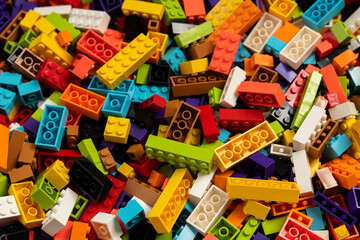 Fototapeta premium Colorful mix of plastic Lego building blocks and bricks background
