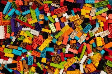Fototapeta premium Colorful mix of plastic Lego building blocks and bricks background