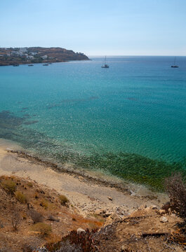Yachts at sea on Kalo Livadi beach on Mykonos Island in Greece.