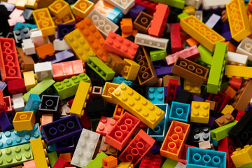 Fototapeta premium Colorful mix of plastic Lego building blocks and bricks background