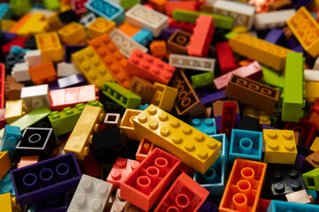 Fototapeta premium Colorful mix of plastic Lego building blocks and bricks background