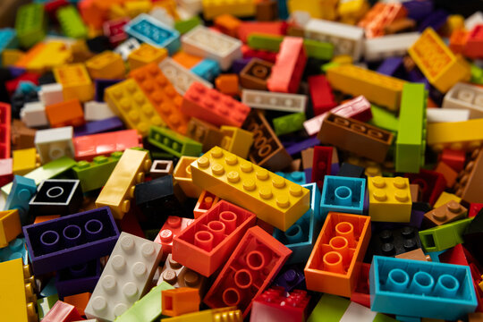 Colorful mix of plastic Lego building blocks and bricks background