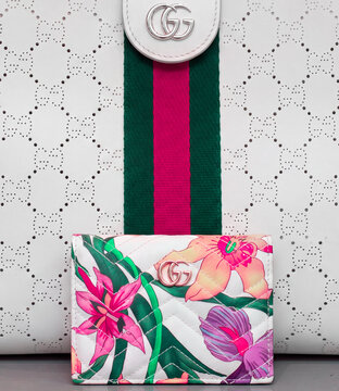 Gucci Flora-patterned card holder featuring a tropical floral print on a white background. Milan, Italy, 14 July 2026