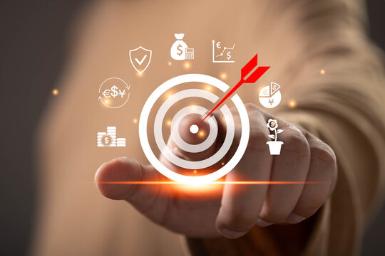 Close-up of a hand selecting a financial target on a virtual interface. Concept of investment strategy, wealth growth, financial planning, business goals, risk management, and profit optimization.