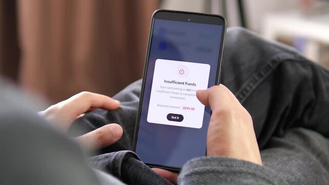 User attempts to pay for an annual digital subscription on a smartphone, but the transaction fails because of insufficient funds, highlighting payment friction and consumer budgeting.