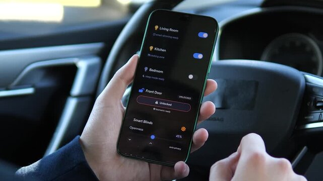 User manages home devices remotely through a mobile app, adjusting temperature, lights, blinds and security settings in a modern connected home ecosystem.