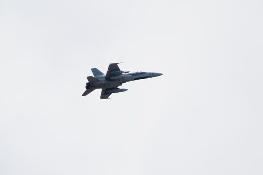 Albacete, Spain - June 12, 2026: An F 18 fighter jet flying in the sky over Los Llanos Air Base, displaying military aviation technology in flight