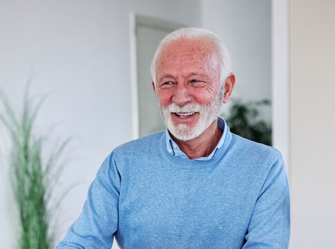 Happy senior old man or businessman client make financial insurance estate business deal contract signing and shaking hands, agent lawyer, satisfied mature customers signing contract meeting bank mana