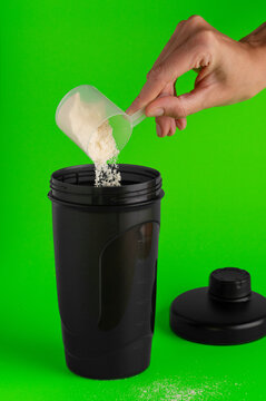 Protein powder pouring into a shaker
