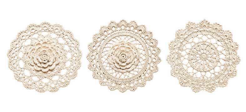 Three beautiful handmade crochet doilies showcasing unique circular designs and detailed floral centerpieces on transparent grid background for textile art and decor.