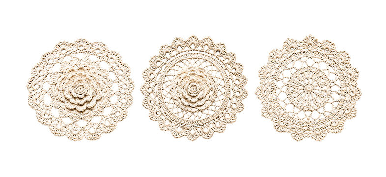 Three exquisite handmade crochet doilies with detailed central rosettes and intricate openwork patterns on a transparent background for vintage craft projects.