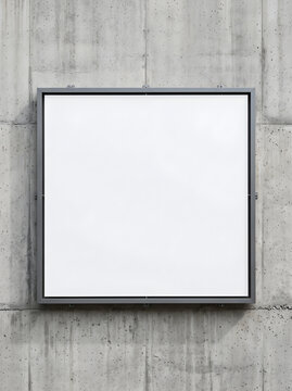 Square Poster Display Mockup Mounted on Textured Concrete Wall