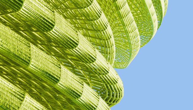 Close-up view of a green abstract woven sculpture outdoors