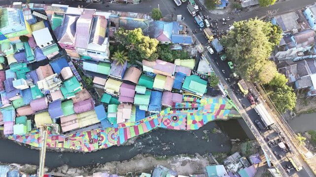 Colorful homes line a winding river