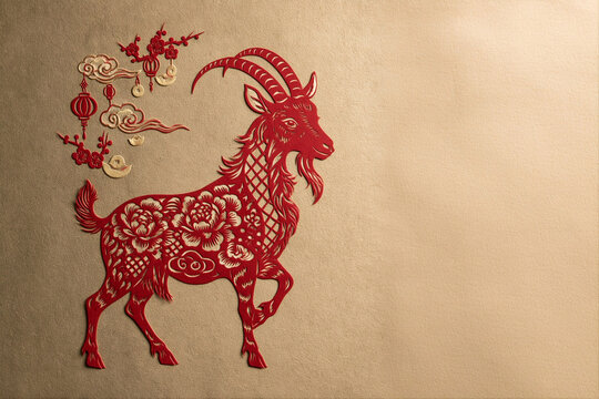 Paper cut silhouette of the red (fire) goat on golden background. 2027 year of the Goat. Chinese zodiac sign. Ancient jianzhi art illustration for banner, card with copy space