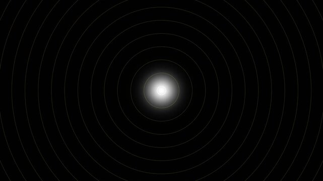 A bright white light glowing at the center of concentric circles in a dark background.