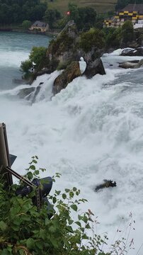 Waterfall rheinfall water stream fall, Rhine river cascades in Switzerland. Power of Nature.