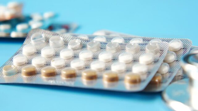 Close up of birth control pills in blister packs, contraceptive methods, medical healthcare concept